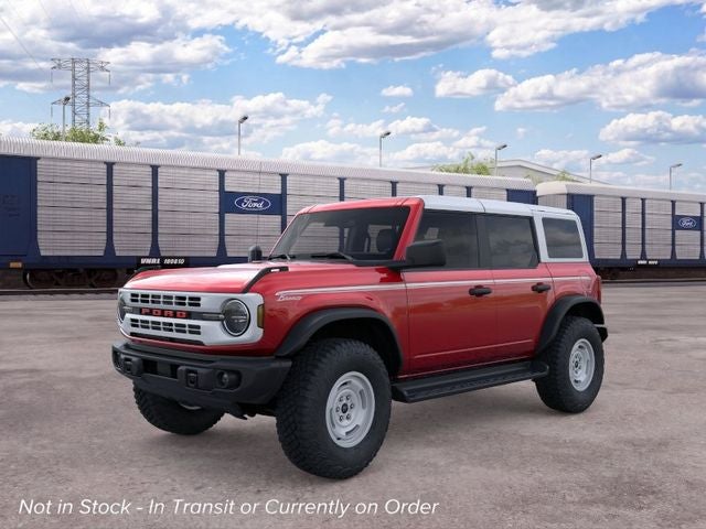 2026 Ford Bronco Heritage Edition in Ruby Red Metallic Tinted Clearcoat — front three-quarter view