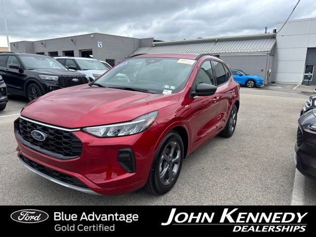 2023 Ford Escape ST-Line in Cinnabar Red Metallic Premium Colorant — front three-quarter view