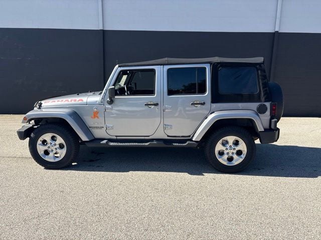 2013 Jeep Wrangler Unlimited Sahara in Billet Metallic Clearcoat — front three-quarter view