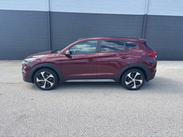 2017 Hyundai Tucson Value in Ruby Wine — front three-quarter view